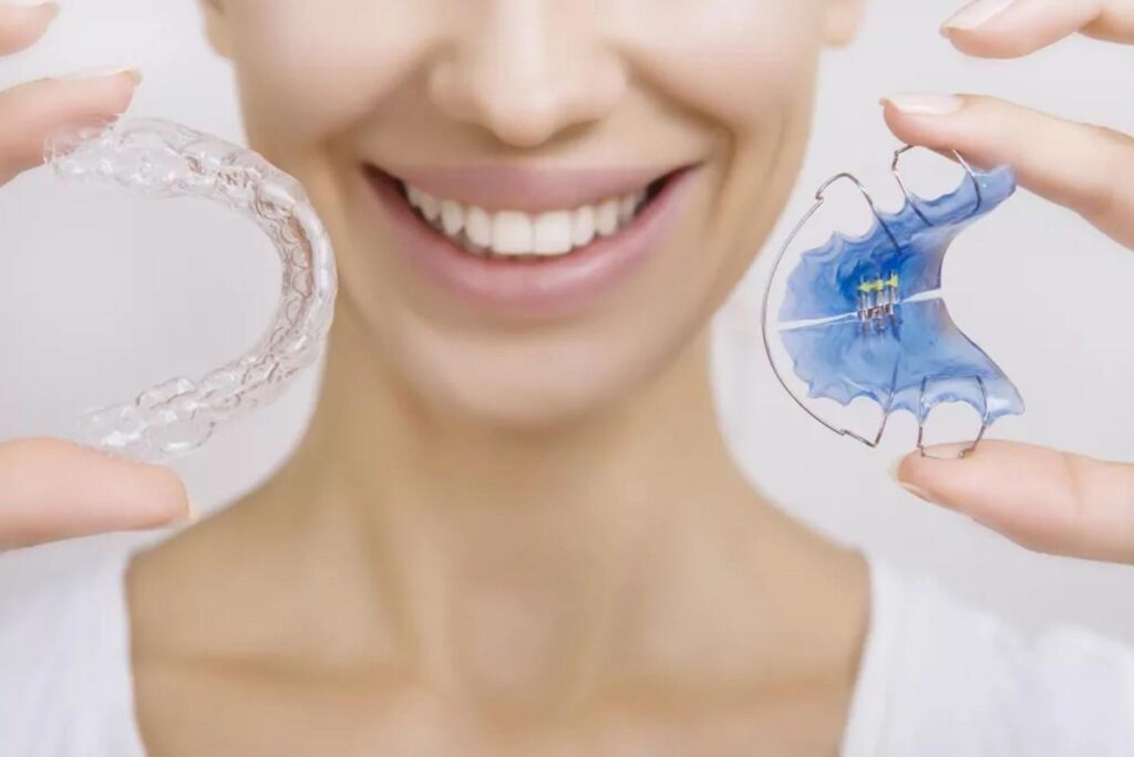 Invisalign in hand of a girl