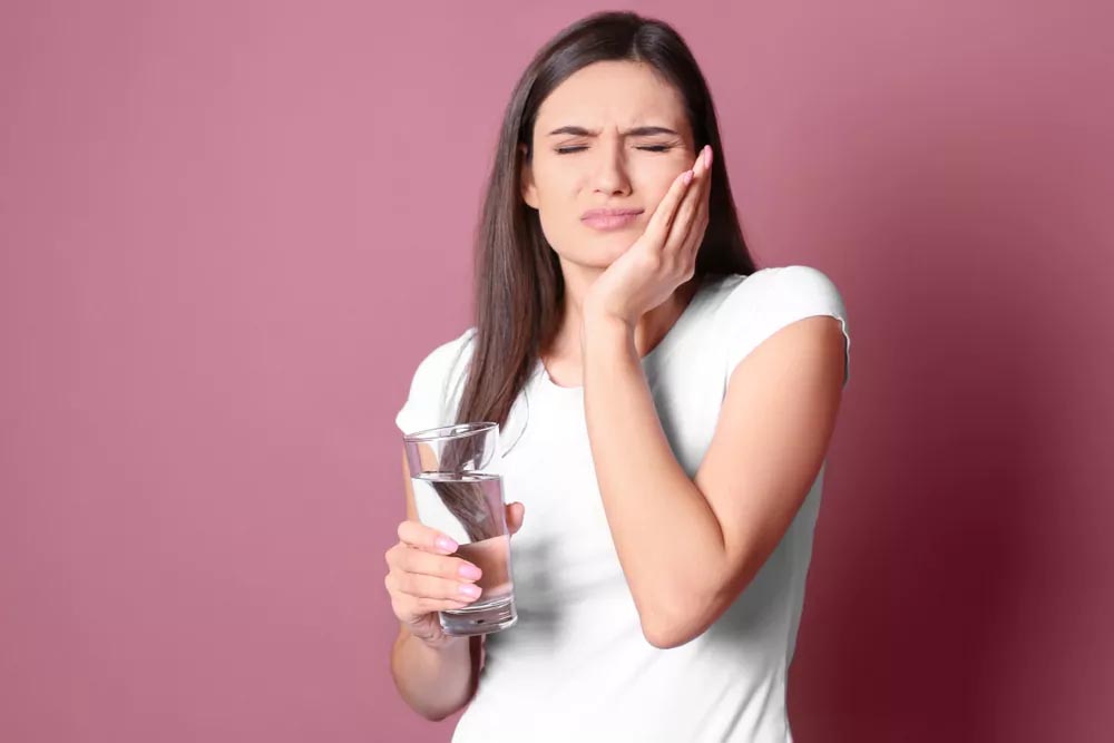 Woman having jaw pain
