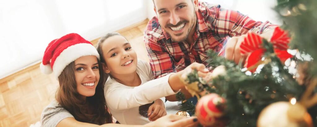 A family celebrating christmas and smiling