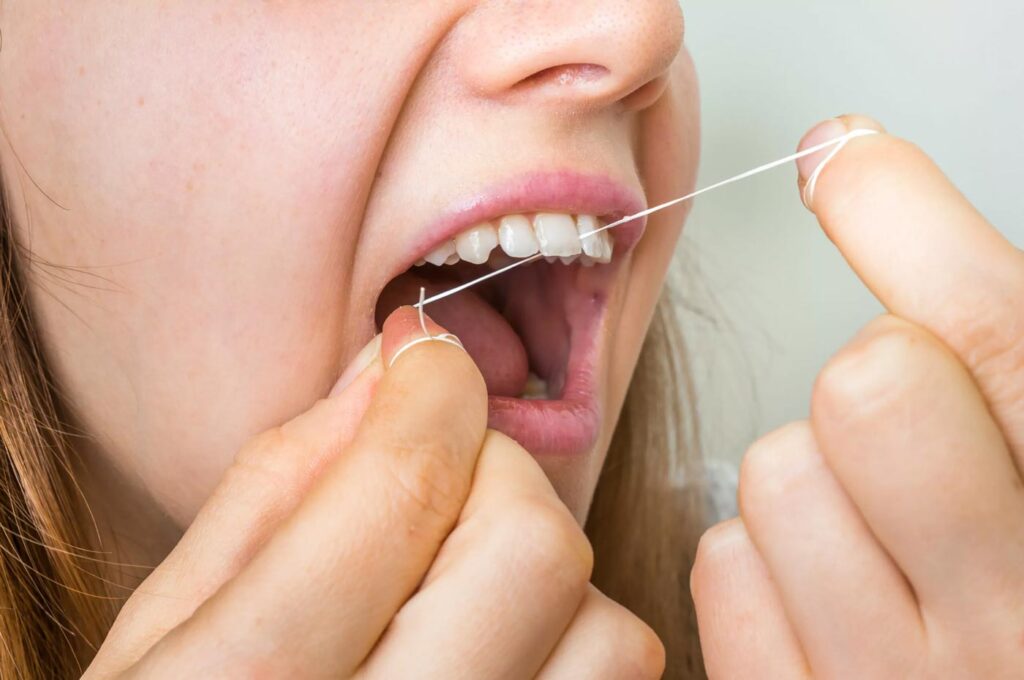 women flossing