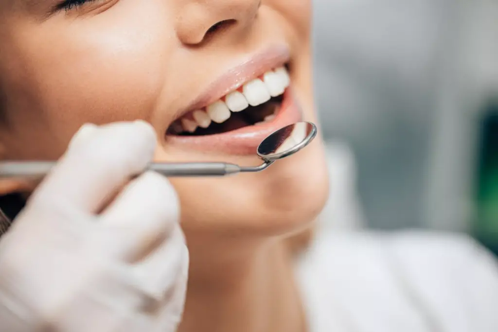 Girl getting her teeth checked