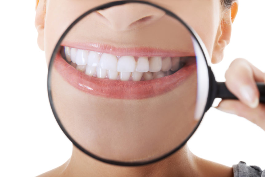 a woman looking at her teeth