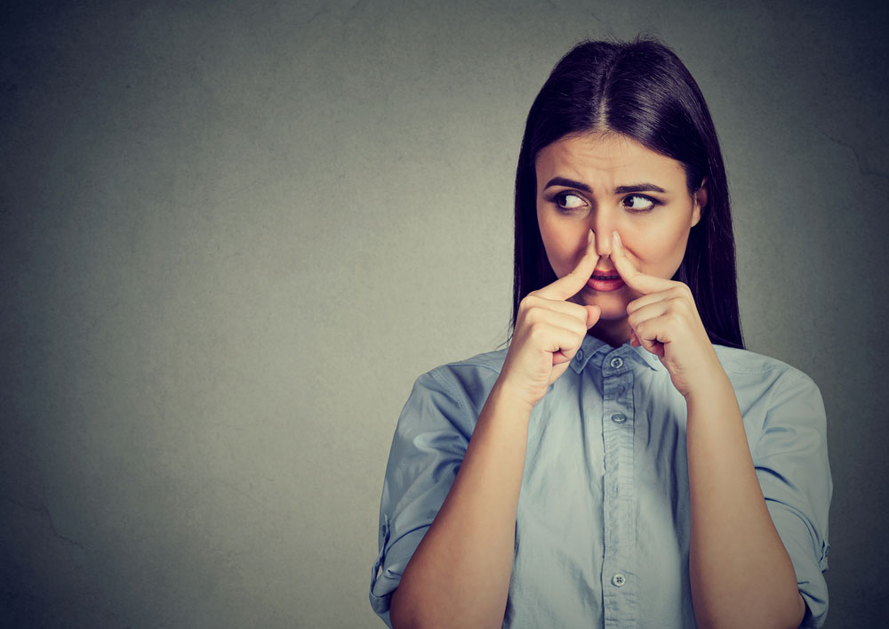 a woman covering her nose