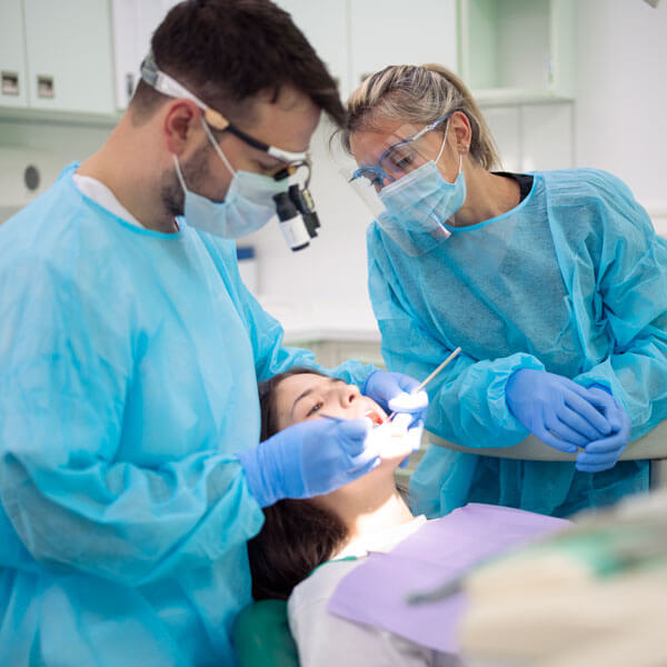 dentist examining a patient's mouth